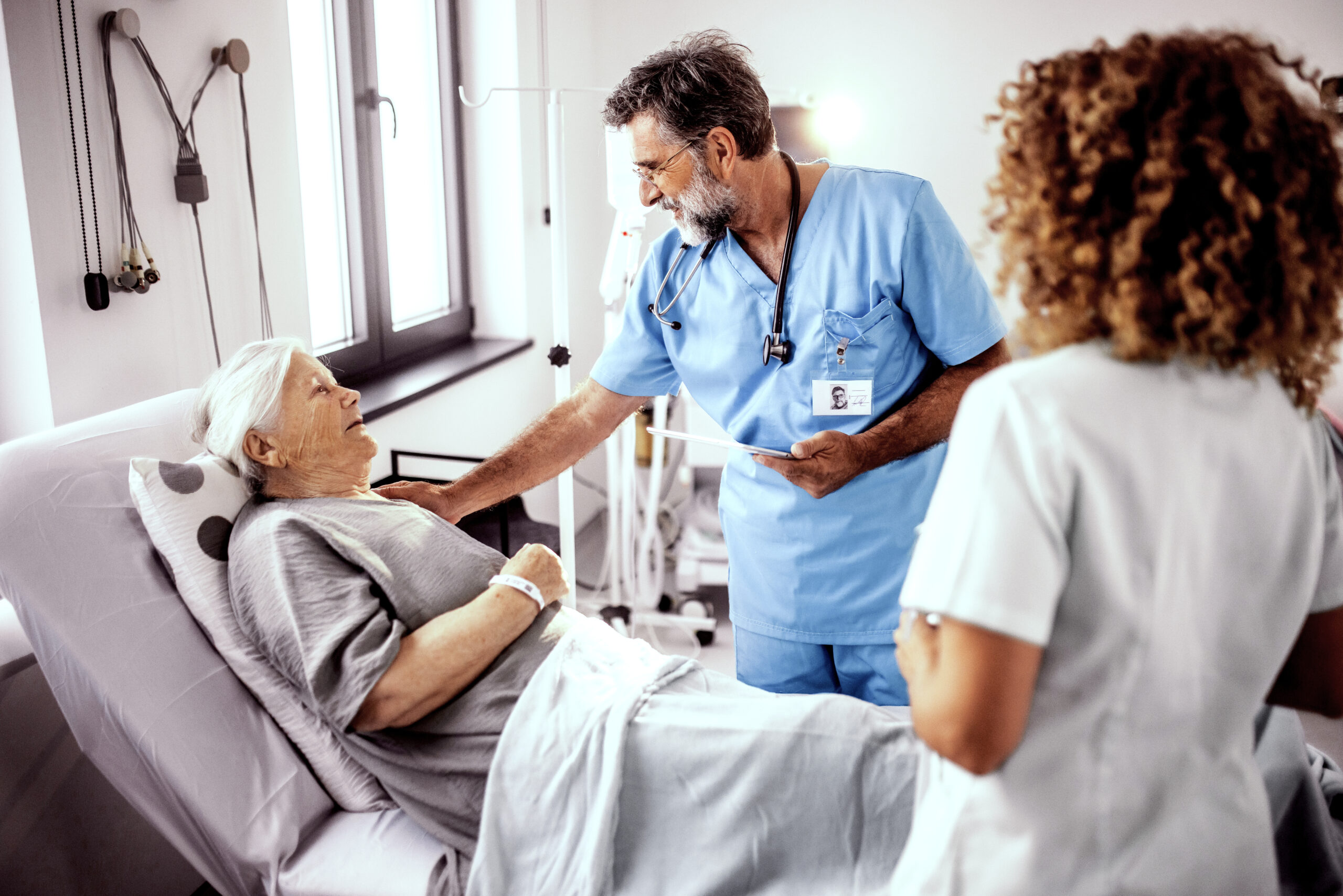doctor and nurse are looking at the results from the patient