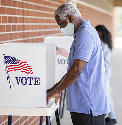 I Stock 1264129782 Man Voting Wearing Mask small blog