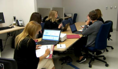 Virtual Ward staff meet to discuss patients. From the JAMA Report video.