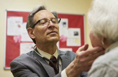 Dr. Gregg Warshaw examines a patient at DuBose Health Center at The Cedars, a retirement community outside Chapel Hill, NC.